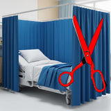 Hospital bed with blue curtains in a clinical setting