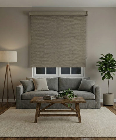 Custom cut-to-size driftwood blockout roller blind in living room setting