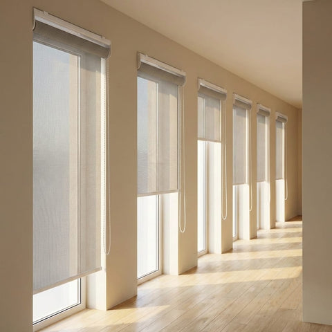 Custom manufactured grey-white 3% sheer roller blinds along passage