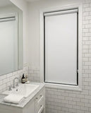 Custom cut-to-size blockout white roller blind in bathroom