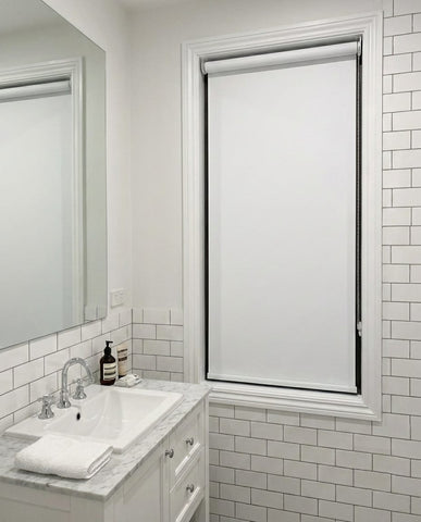 Custom cut-to-size blockout white roller blind in bathroom